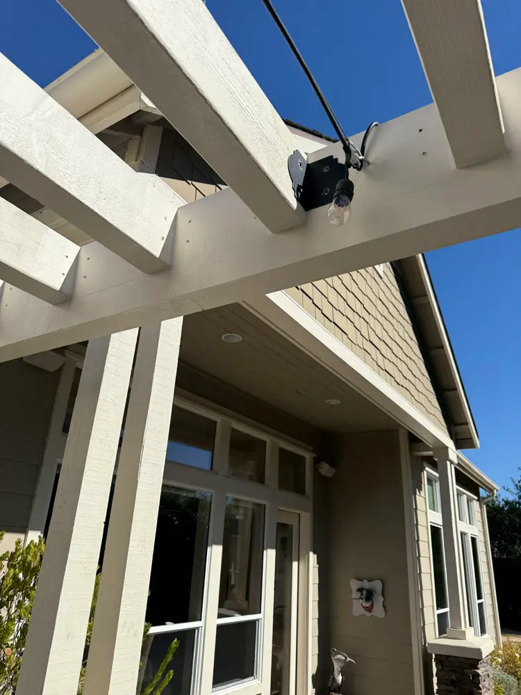 Painted pergola beams, eaves and shingle detail on a Central Coast home